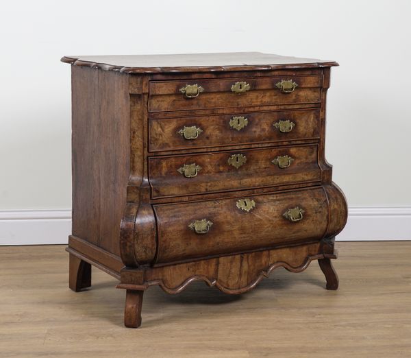 AN EARLY 19TH CENTURY DUTCH WALNUT BOMBE FOUR DRAWER COMMODE