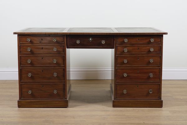 AN 19TH CENTURY MAHOGANY ELEVEN DRAWER KNEEHOLE WRITING DESK