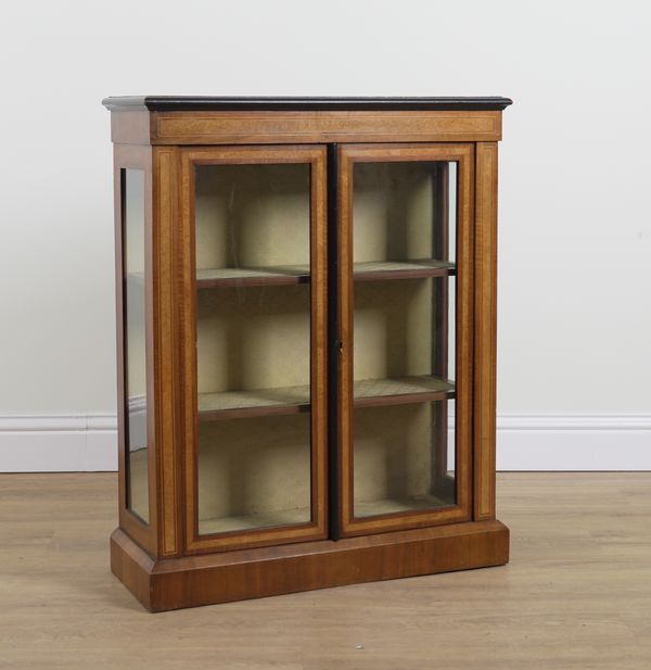 A VICTORIAN WALNUT GLAZED TWO DOOR CABINET