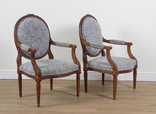 A PAIR OF LOUIS XVI STYLE STAINED BEECH OPEN ARMCHAIRS (2)