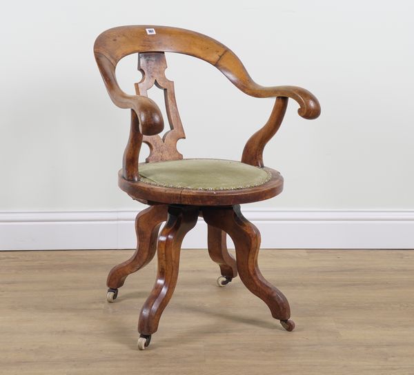 A VICTORIAN WALNUT REVOLVING DESK CHAIR