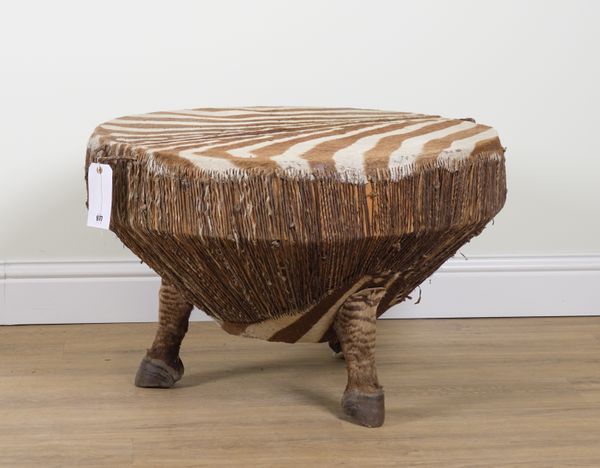 A ZEBRA SKIN DRUM TABLE