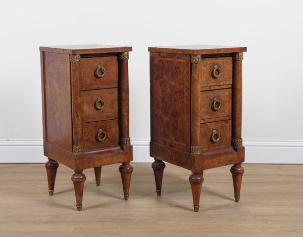 A PAIR OF CONTINENTAL GILT METAL MOUNTED FIGURED WALNUT THREE DRAWER BEDSIDE CHESTS (2)