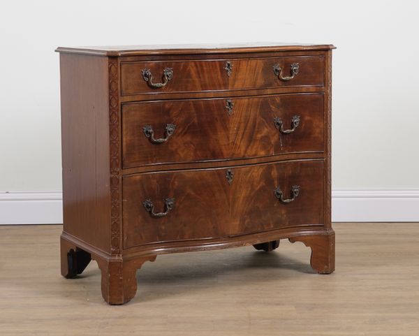 A GEORGE III MAHOGANY SERPENTINE THREE DRAWER CHEST