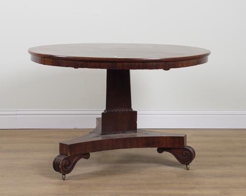 A REGENCY MAHOGANY CIRCULAR SNAP TOP BREAKFAST TABLE