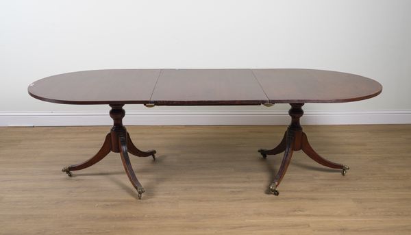 A REGENCY MAHOGANY D-END EXTENDING DINING TABLE