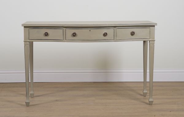 A GEORGE III STYLE GREY PAINTED SERPENTINE THREE DRAWER SIDE TABLE