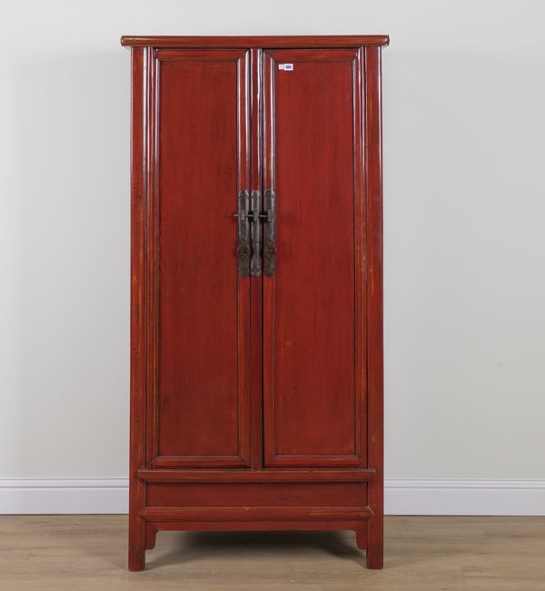 AN EARLY 20TH CENTURY CHINESE EXPORT SCARLET LACQUERED TWO DRAWER WARDROBE