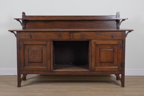 AN ARTS AND CRAFTS OAK SIDEBOARD