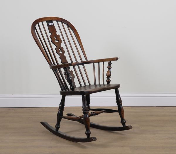 A 19TH CENTURY ASH AND ELM WINDSOR ROCKING CHAIR