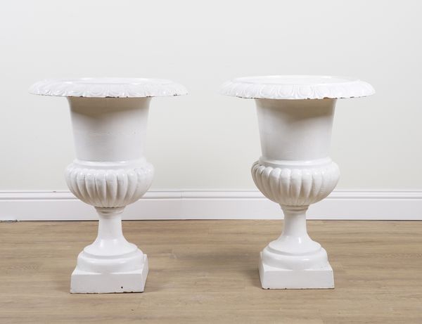 A PAIR OF LATE 19TH CENTURY CAST IRON SEMI FLUTED JARDINIERES (2)