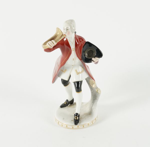 A BERLIN PORCELAIN FIGURE OF A HUNTSMAN