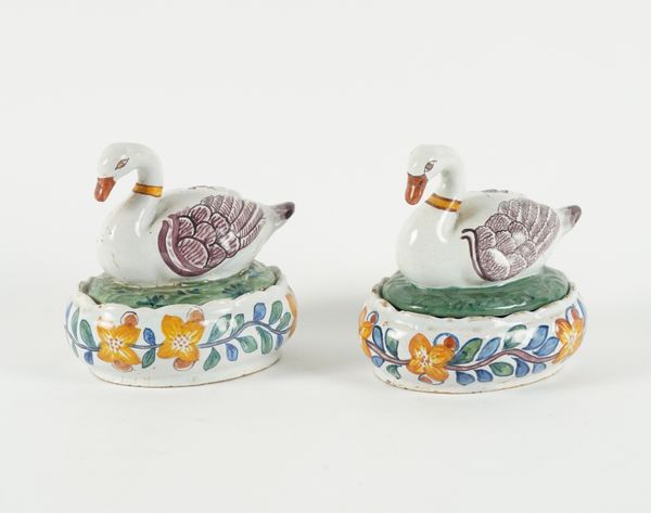 TWO DUTCH DELFT SWAN- FORM OVAL BUTTER DISHES AND COVERS (4)