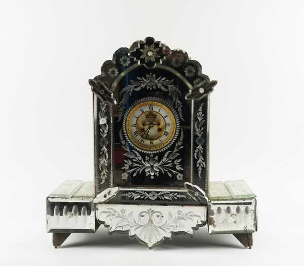 AN ETCHED MIRRORED GLASS MANTEL CLOCK