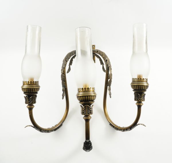 A SET OF TEN PATINATED GILT-BRASS THREE LIGHT WALL LIGHTS (10)