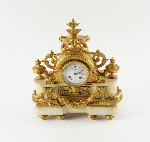 A FRENCH LOUIS XVI STYLE GILT-BRONZE MOUNTED WHITE MARBLE MANTEL CLOCK