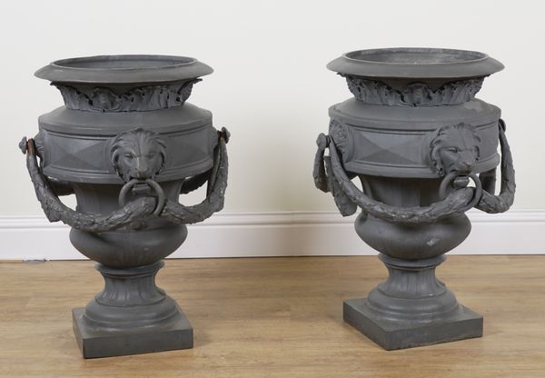 A PAIR OF LARGE PATINATED CAST IRON URNS WITH DECORATIVE SWAGS (2)