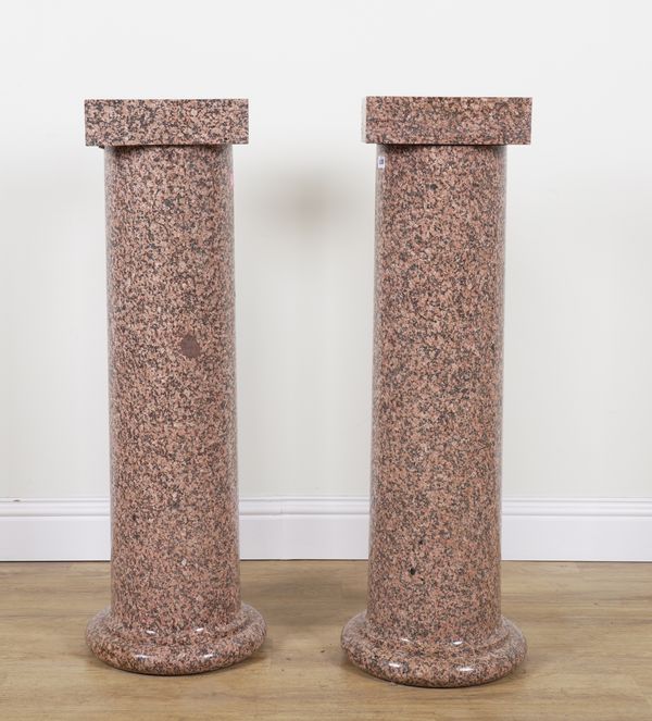 A PAIR OF POLISHED PINK GRANITE PEDESTAL COLUMNS (2)