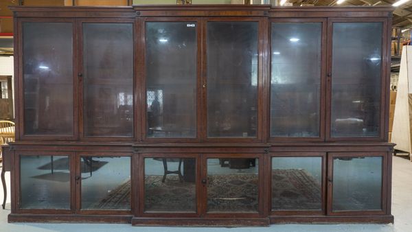 A LARGE 19TH CENTURY MAHOGANY BREAKFRONT BOOKCASE CABINET