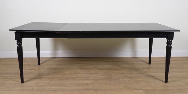 A CONTEMPORARY EBONISED EXTENDING DINING TABLE