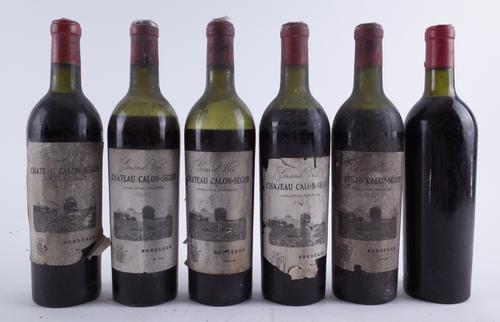 FIVE BOTTLES CHÂTEAU CALON-SÉGUR 1947 AND ONE BOTTLE BELIEVED TO BE THE SAME