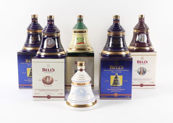 A COLLECTION OF BELLS WHISKY DECANTERS INCLUDING THREE CELEBRATING THE PRINCE OF WALES’ 50TH BIRTHDAY (18)