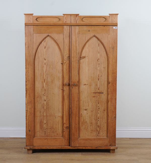 A 19TH CENTURY CONTINENTAL PINE TWO DOOR WARDROBE