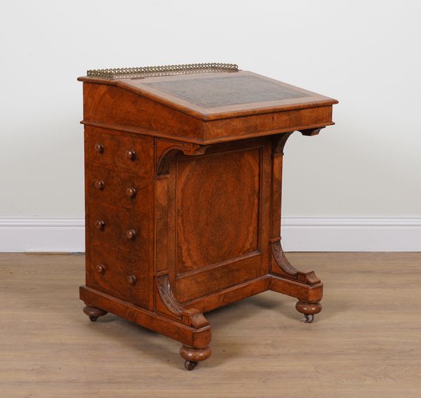 A VICTORIAN FIGURED WALNUT DAVENPORT