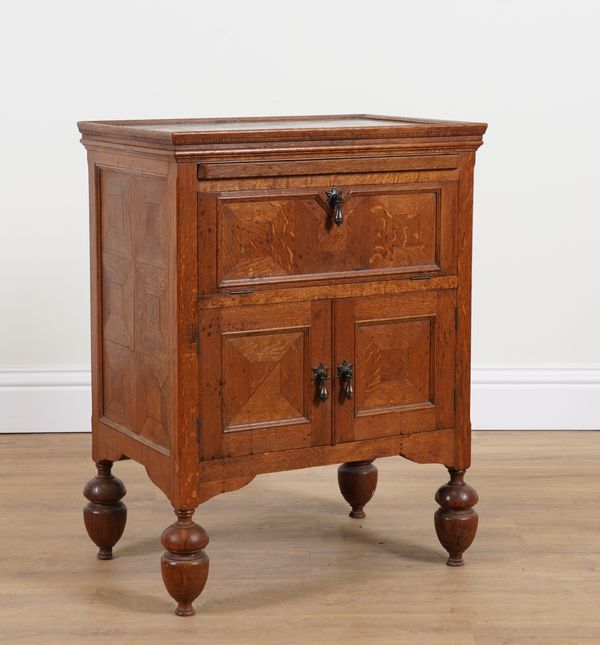 AN EARLY 20TH CENTURY OAK SIDE CABINET