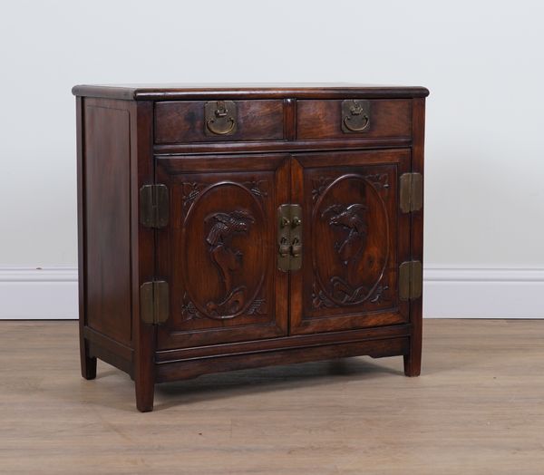 A CHINESE EXPORT CARVED HARDWOOD LOW SIDE CUPBOARD