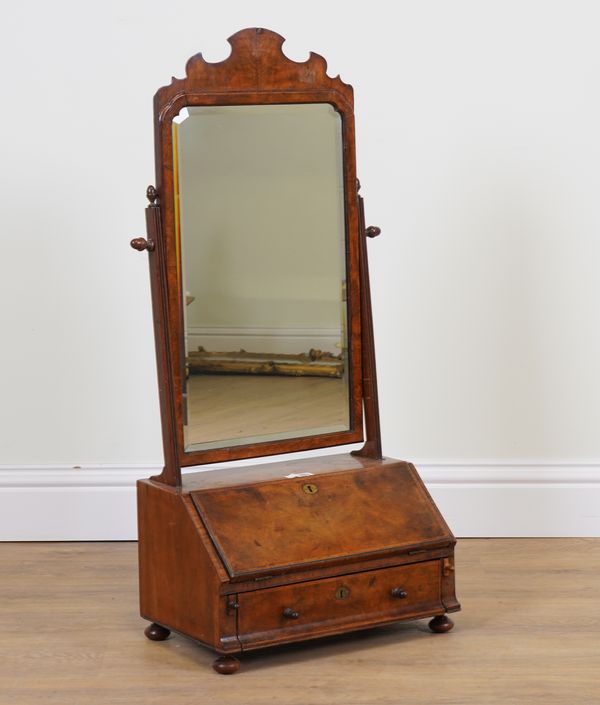 AN EARLY 18TH CENTURY WALNUT FEATHER BANDED SWING FRAME TOILET MIRROR