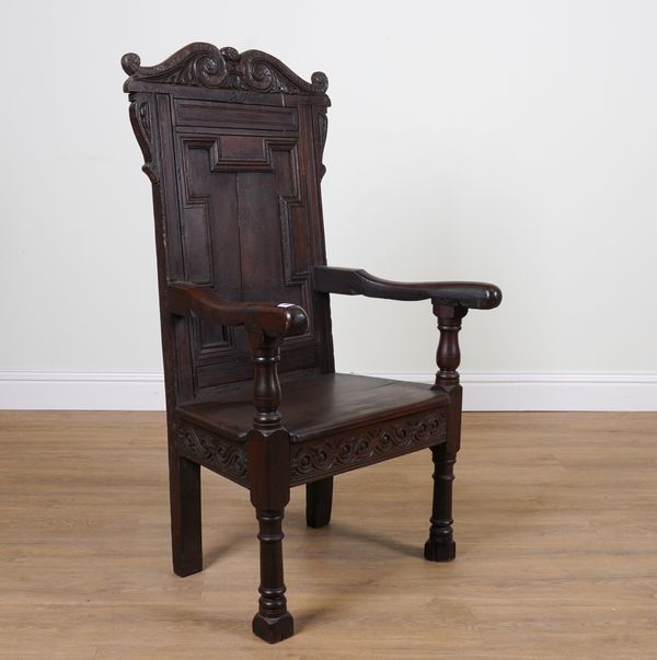 A 17TH CENTURY AND LATER OAK WAINSCOT OPEN ARMCHAIR