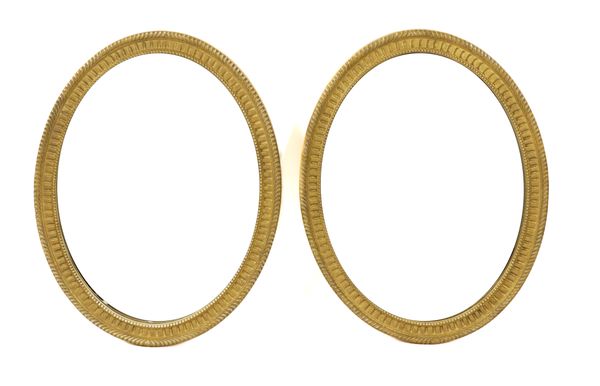 A PAIR OF GOLD PAINTED OVAL WALL MIRRORS (2)