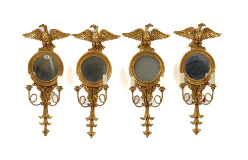 A SET OF FOUR REGENCY STYLE GILT WOOD CIRCULAR WALL MIRRORS (4)