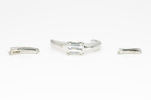 A PLATINUM AND DIAMOND SINGLE STONE RING