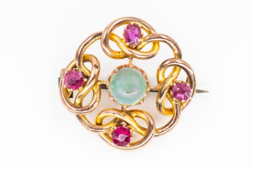 A GOLD, OPAL AND RUBY SET BROOCH