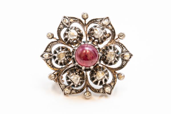 A DIAMOND AND CABOCHON RUBY HEXAGONAL BROOCH