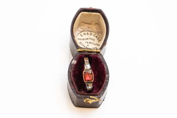 A GEORGIAN GARNET AND ROSE DIAMOND THREE STONE RING