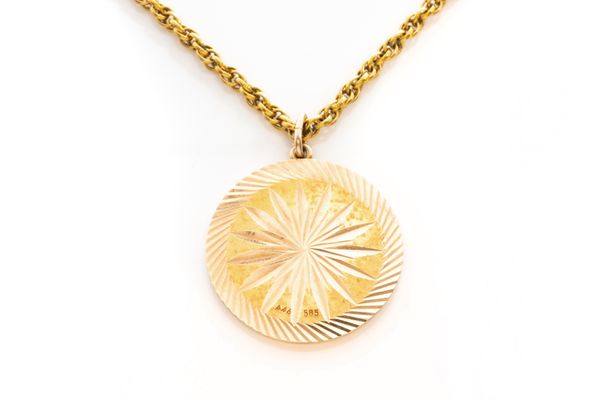 A GOLD PENDANT AND A GILT METAL NECKCHAIN