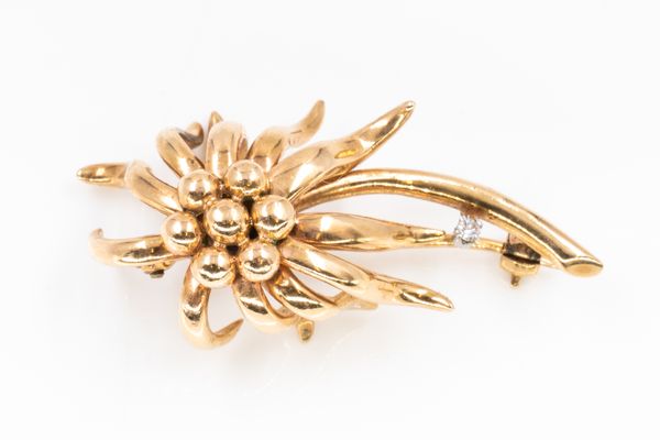 A GOLD AND DIAMOND FLOWER SPRAY BROOCH