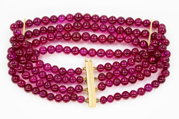 A TREATED RUBY BEAD BRACELET AND THREE SINGLE ROW NECKLACES (4)