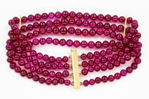 A TREATED RUBY BEAD BRACELET AND THREE SINGLE ROW NECKLACES (4)
