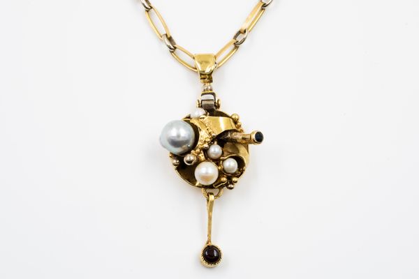 A GOLD, CULTURED PEARL AND GEM SET PENDANT WITH A GOLD NECKCHAIN (2)