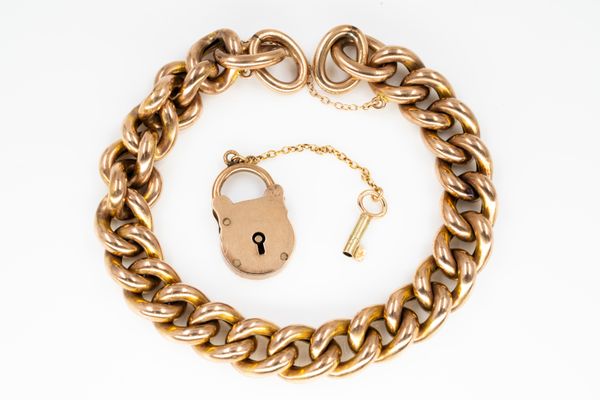 A GOLD CURB LINK BRACELET AND A PADLOCK SHAPED CLASP (2)