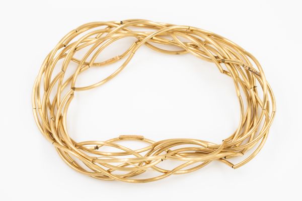 NINE ELASTICATED GOLD BRACELETS (9)