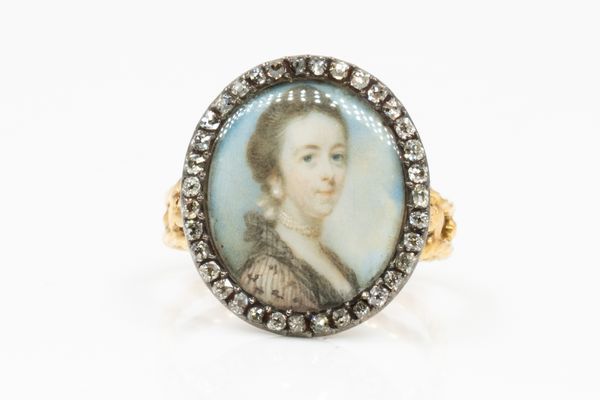 A GOLD AND DIAMOND SET PORTRAIT MINIATURE LATER MOUNTED AS A RING