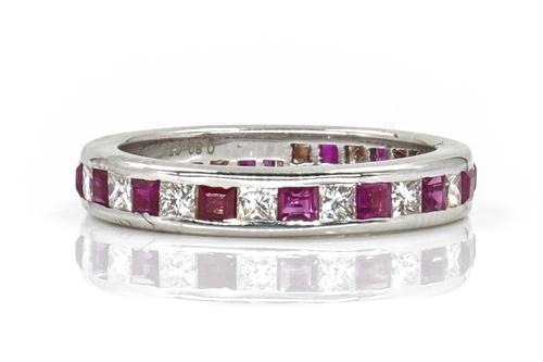 A WHITE GOLD, RUBY AND DIAMOND FULL ETERNITY RING