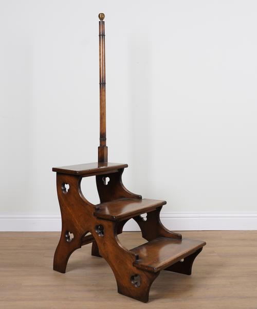 A SET OF GOTHIC REVIVAL MAHOGANY THREE RUNG LIBRARY STEPS