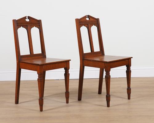 A PAIR OF VICTORIAN GOTHIC REVIVAL OAK HALL CHAIRS (2)
