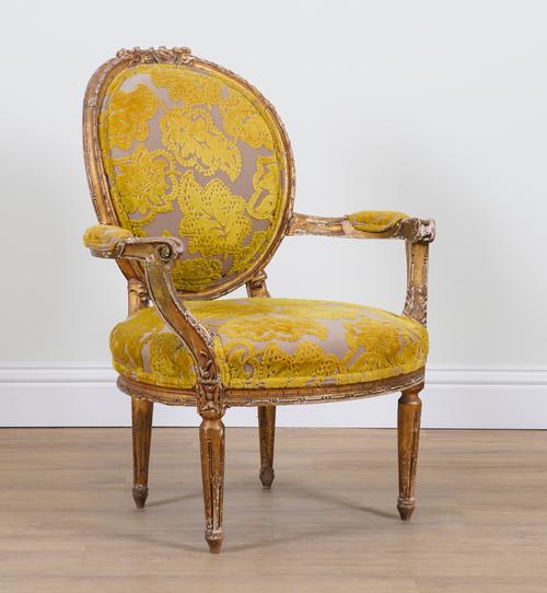 A LOUIS XVI STYLE GILT FRAMED OPEN ARMCHAIR